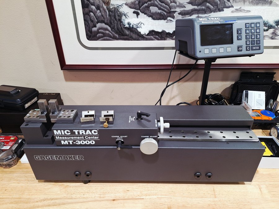 Bench measurement center with micrometers and setting standards alongside